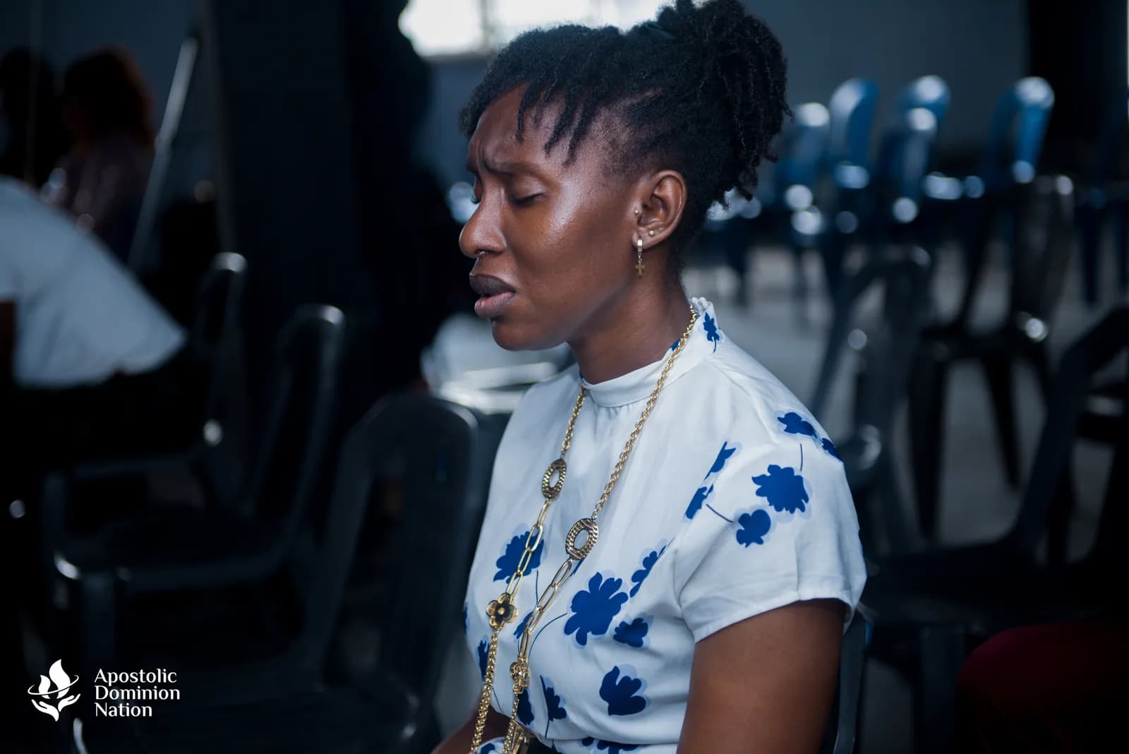 Woman standing during service