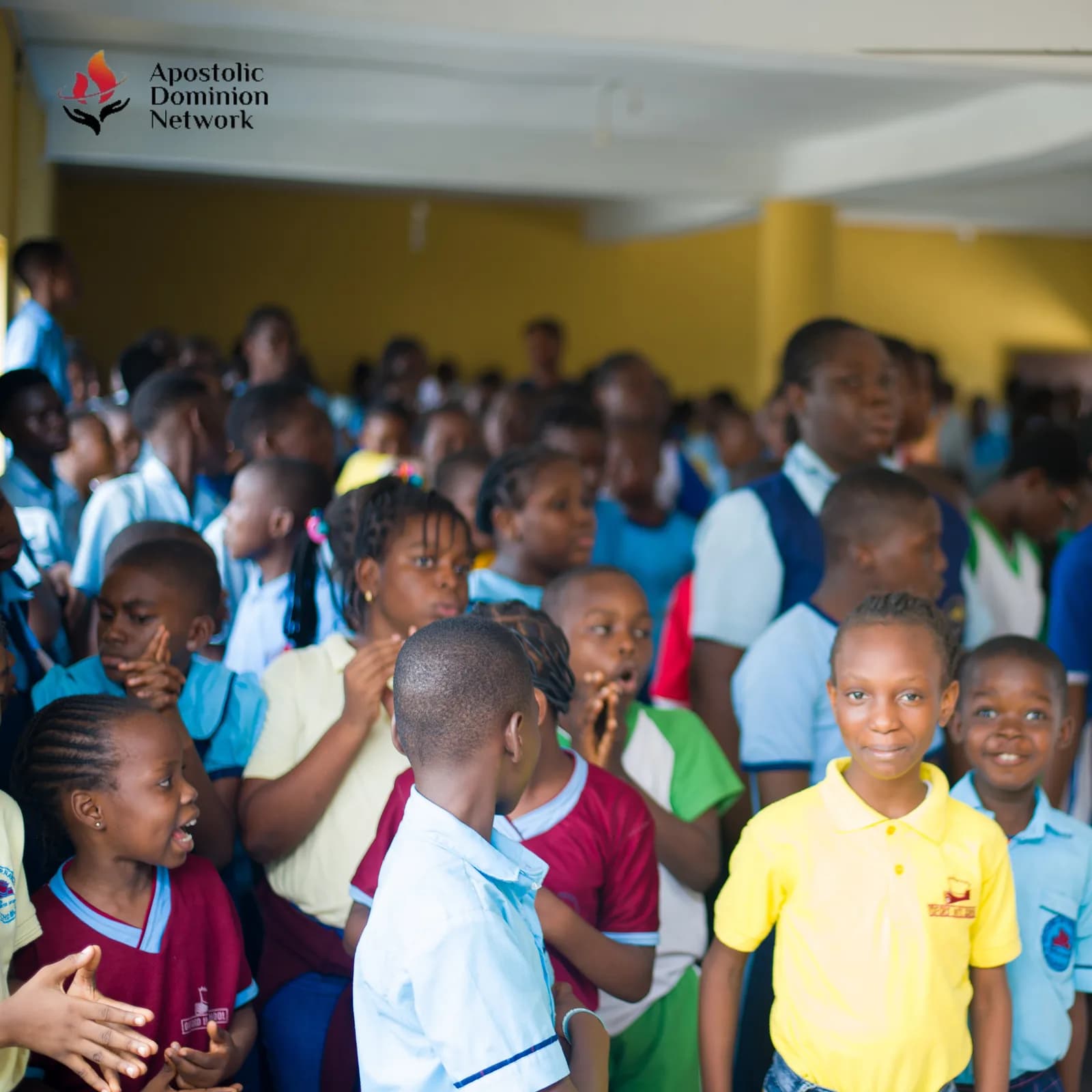 Children smiling in a classroom